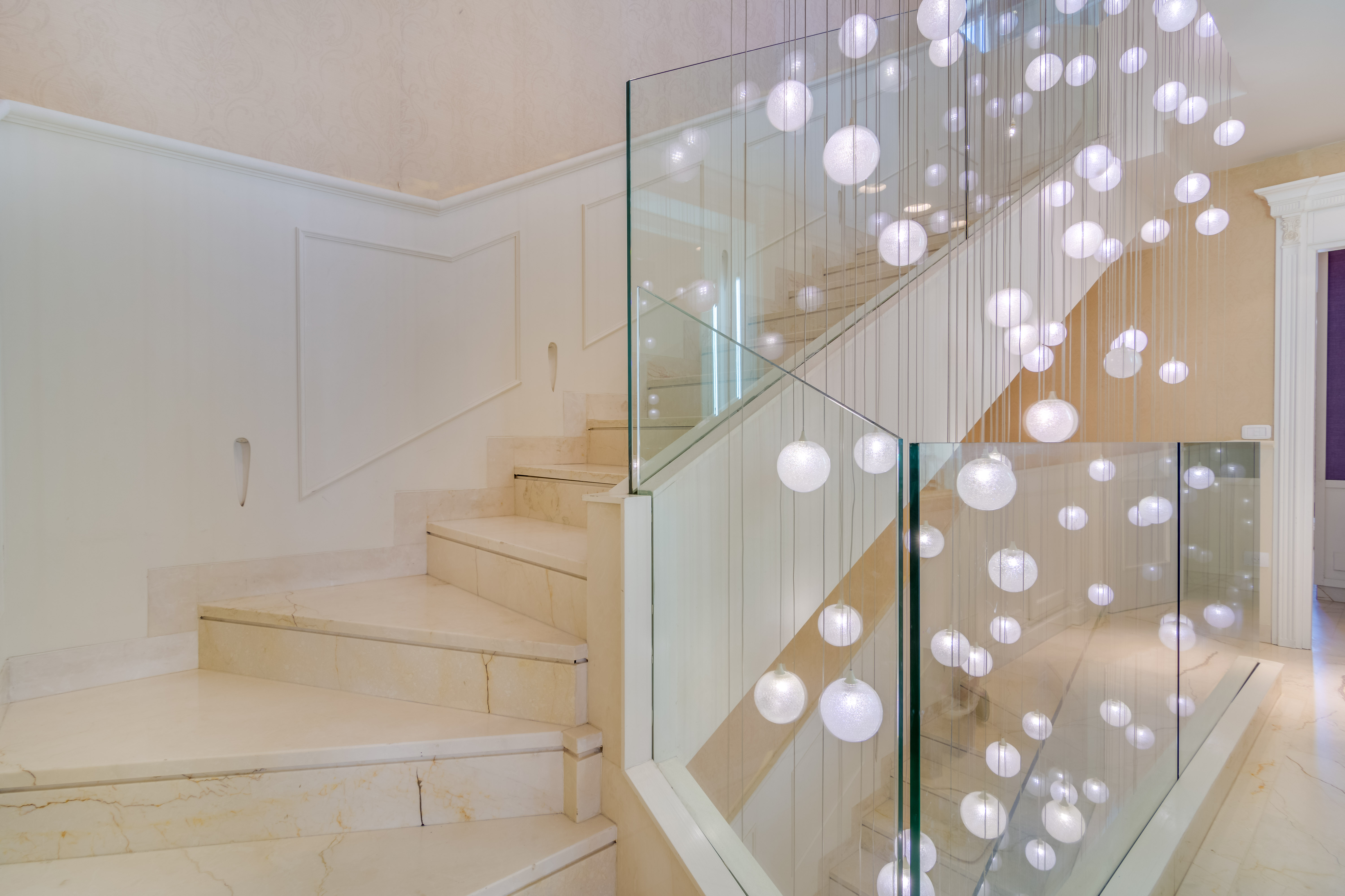 Staircase between all floors with beautiful lights!